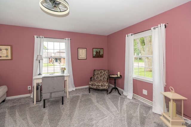 609 3rd St, Muskegon, MI 49445 - living area featuring plenty of natural light, carpet, and baseboards