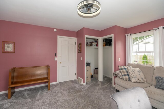 609 3rd St, Muskegon, MI 49445 - carpeted living room featuring baseboards