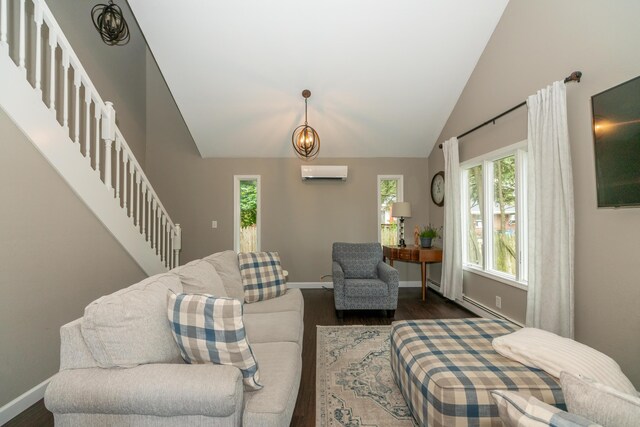 609 3rd St, Muskegon, MI 49445 - living room featuring a wall unit AC, dark wood finished floors, healthy amount of natural light, stairs, and lofted ceiling