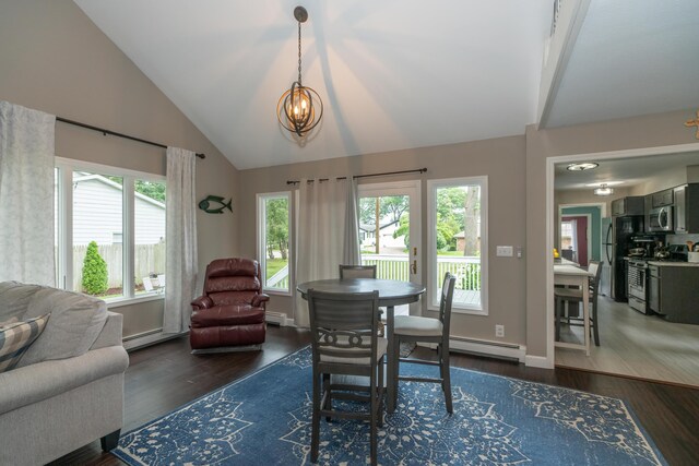 609 3rd St, Muskegon, MI 49445 - dining area with vaulted ceiling, baseboard heating, dark wood-style flooring, a chandelier, and baseboards
