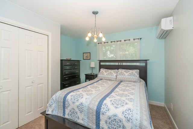 609 3rd St, Muskegon, MI 49445 - carpeted bedroom featuring a wall mounted air conditioner, a chandelier, baseboards, and a closet