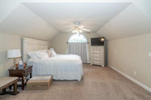 609 3rd St, Muskegon, MI 49445 - bedroom with lofted ceiling, light carpet, baseboards, and a ceiling fan
