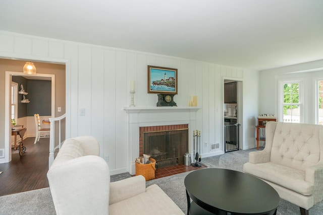 609 3rd St, Muskegon, MI 49445 - living area with a fireplace, baseboards, and wood finished floors