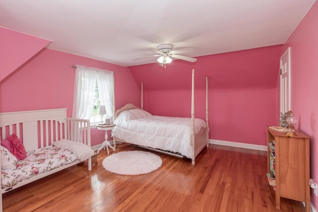 609 3rd St, Muskegon, MI 49445 - bedroom featuring vaulted ceiling, wood finished floors, baseboards, and a ceiling fan
