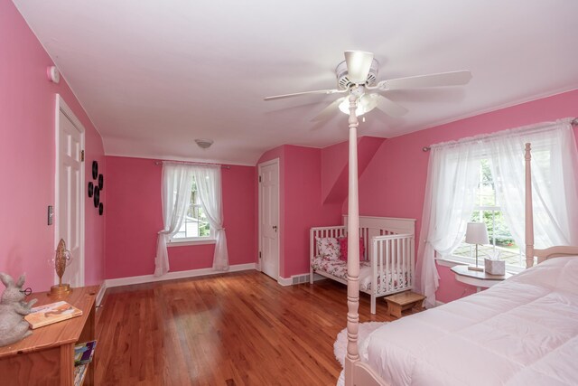 609 3rd St, Muskegon, MI 49445 - bedroom with wood finished floors, baseboards, and a ceiling fan