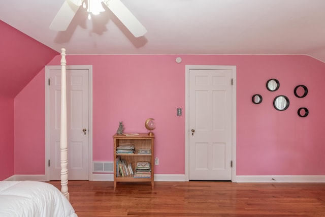 609 3rd St, Muskegon, MI 49445 - bedroom featuring lofted ceiling, wood finished floors, baseboards, and ceiling fan
