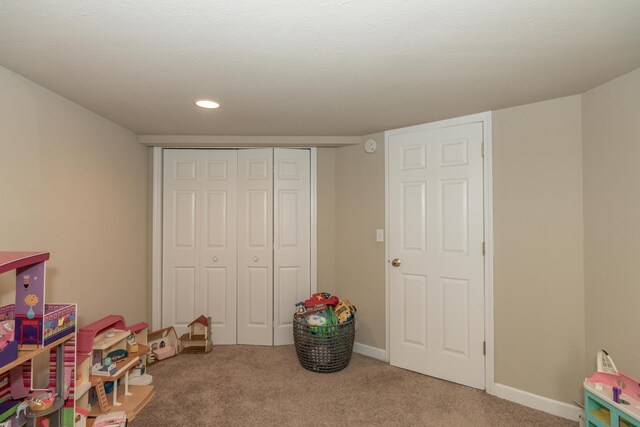 609 3rd St, Muskegon, MI 49445 - rec room with carpet flooring, recessed lighting, and baseboards