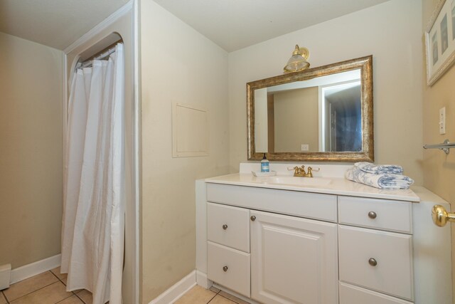 609 3rd St, Muskegon, MI 49445 - full bath featuring tile patterned flooring, vanity, and baseboards