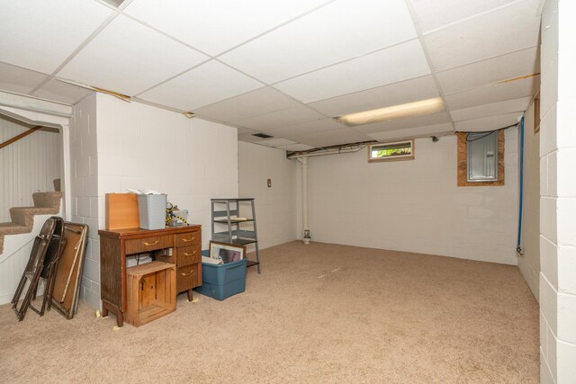 609 3rd St, Muskegon, MI 49445 - below grade area with electric panel, carpet floors, stairs, concrete block wall, and a paneled ceiling