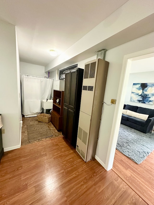 hallway featuring light hardwood / wood-style flooring