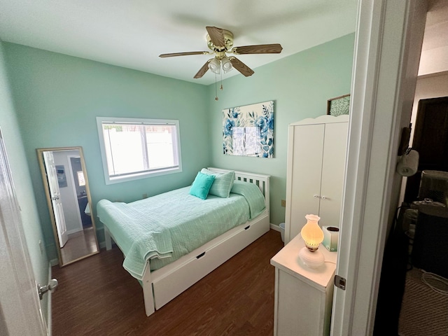 bedroom featuring ceiling fan and dark hardwood / wood-style floors