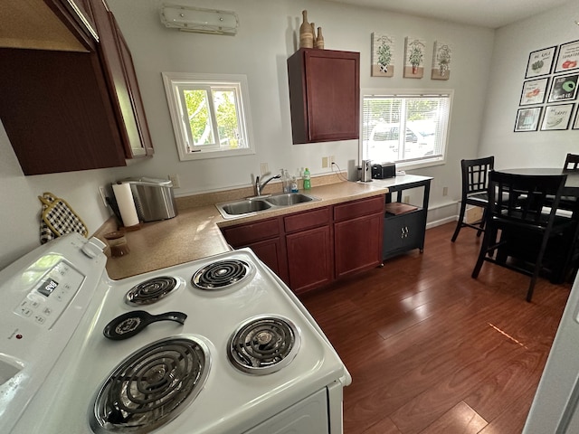 kitchen with sink, dark wood-type flooring, plenty of natural light, and white electric range