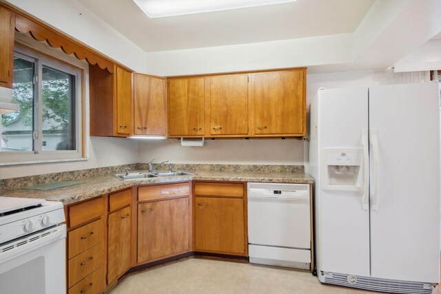2973 Round Lake Hwy, Manitou Beach, MI 49253 - kitchen featuring white appliances, a sink, light countertops, and brown cabinets
