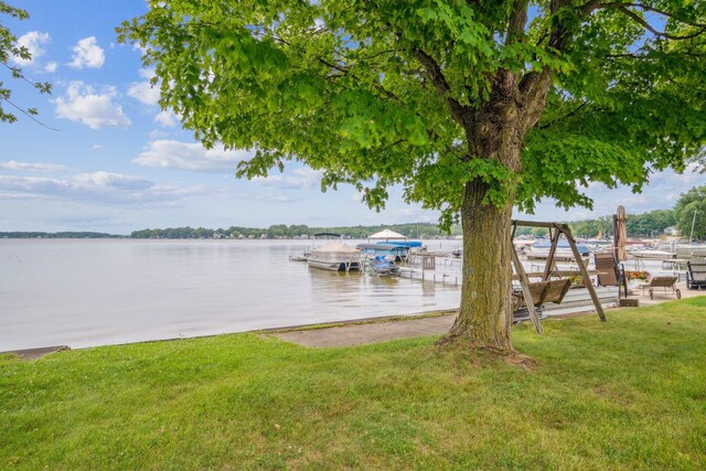 2973 Round Lake Hwy, Manitou Beach, MI 49253 - dock area with a water view and a yard
