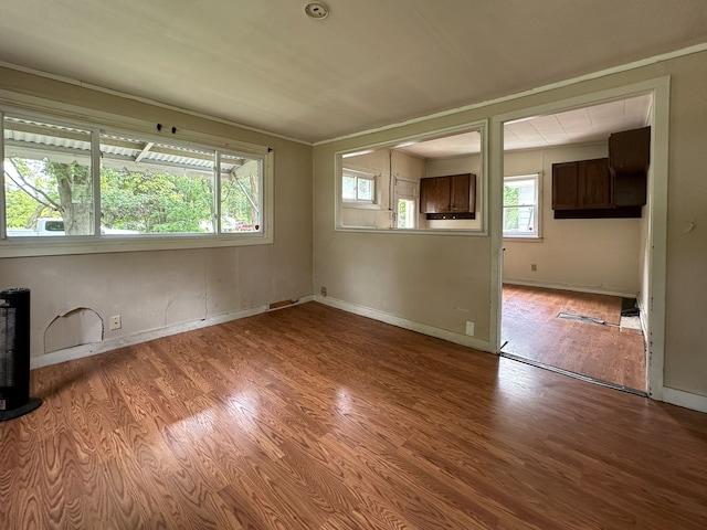 empty room with light wood-type flooring and a wealth of natural light