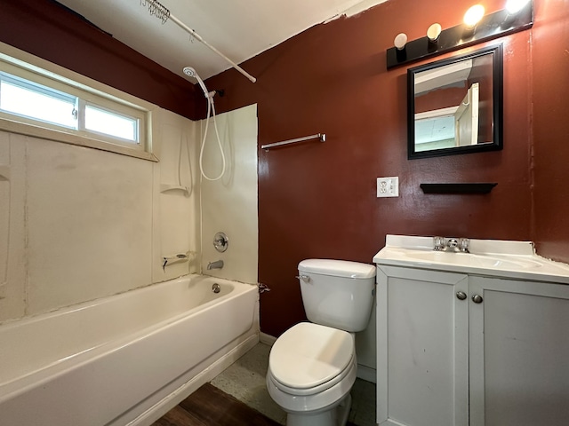 full bathroom featuring hardwood / wood-style flooring, vanity, bathtub / shower combination, and toilet