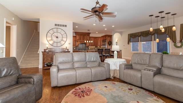 740 Greystone Dr, Chelsea, MI 48118 - living room featuring a ceiling fan, wood finished floors, stairway, baseboards, and recessed lighting