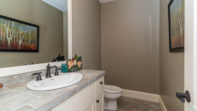 740 Greystone Dr, Chelsea, MI 48118 - half bathroom with toilet, vanity, tile patterned floors, and baseboards