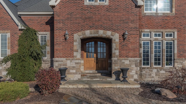 740 Greystone Dr, Chelsea, MI 48118 - view of exterior entry with stone siding and brick siding