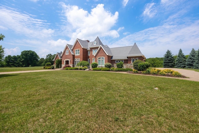 740 Greystone Dr, Chelsea, MI 48118 - view of front of home with a front yard and stone siding