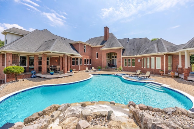 740 Greystone Dr, Chelsea, MI 48118 - outdoor pool featuring a patio area