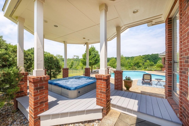 740 Greystone Dr, Chelsea, MI 48118 - wooden deck with a covered hot tub and an outdoor pool