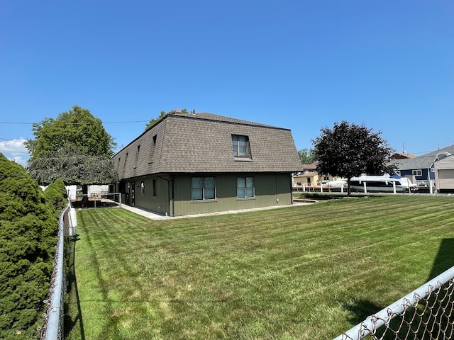 46070 Edgewater Dr, Chesterfield, MI 48047 - back of house with a shingled roof and mansard roof