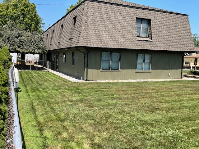 46070 Edgewater Dr, Chesterfield, MI 48047 - back of house with a shingled roof and mansard roof