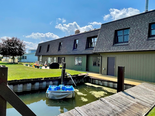 46070 Edgewater Dr, Chesterfield, MI 48047 - dock area featuring a water view and a yard