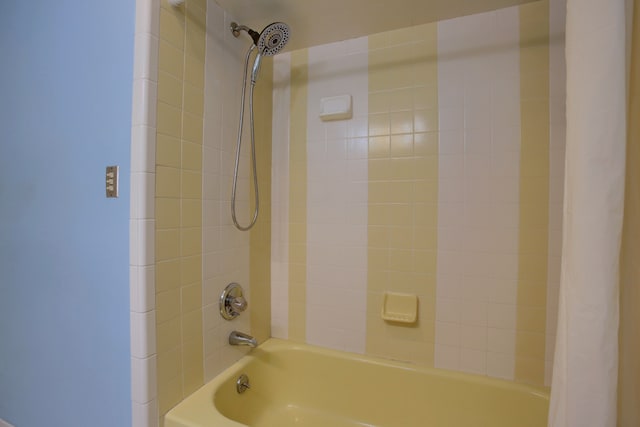 bathroom with shower / tub combo with curtain