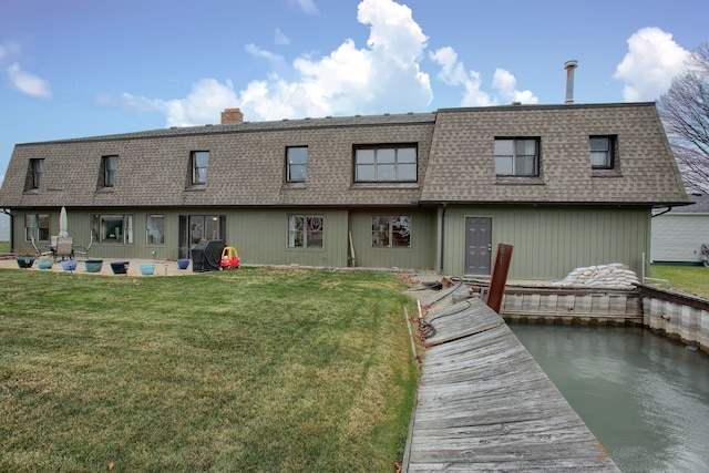 46070 Edgewater Dr, Chesterfield, MI 48047 - back of property featuring a shingled roof, mansard roof, and a yard