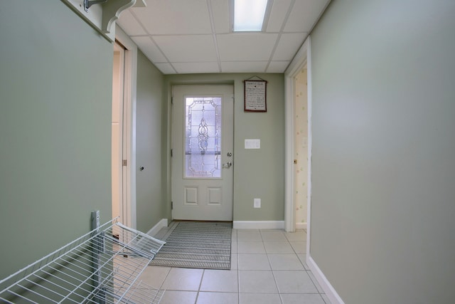 46070 Edgewater Dr, Chesterfield, MI 48047 - entryway featuring a paneled ceiling, light tile patterned floors, and baseboards