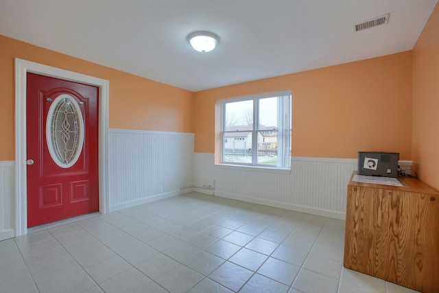 46070 Edgewater Dr, Chesterfield, MI 48047 - foyer featuring a wainscoted wall and light tile patterned flooring