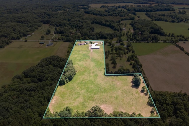 birds eye view of property with a rural view