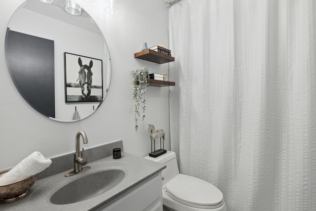 bathroom with vanity and toilet