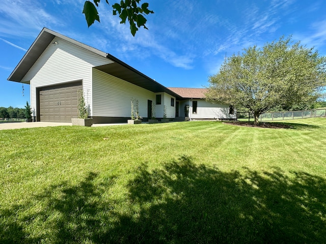 exterior space with a garage and a yard