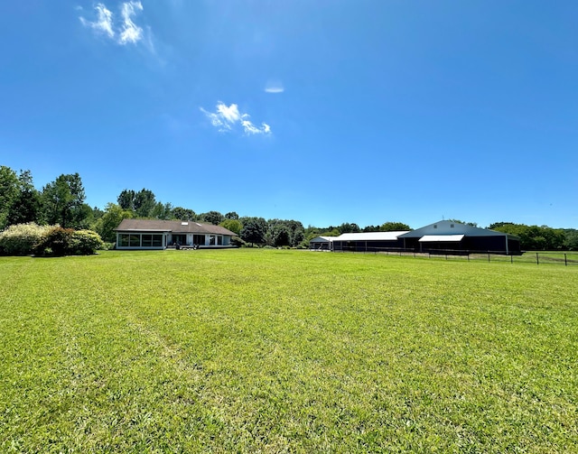 view of yard with a rural view