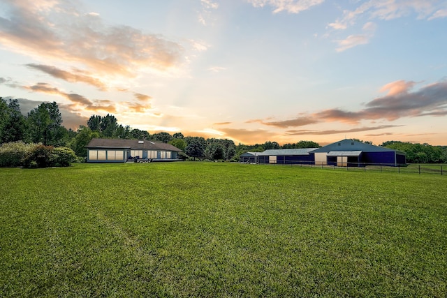 view of yard at dusk