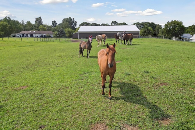 surrounding community featuring an outbuilding and a rural view