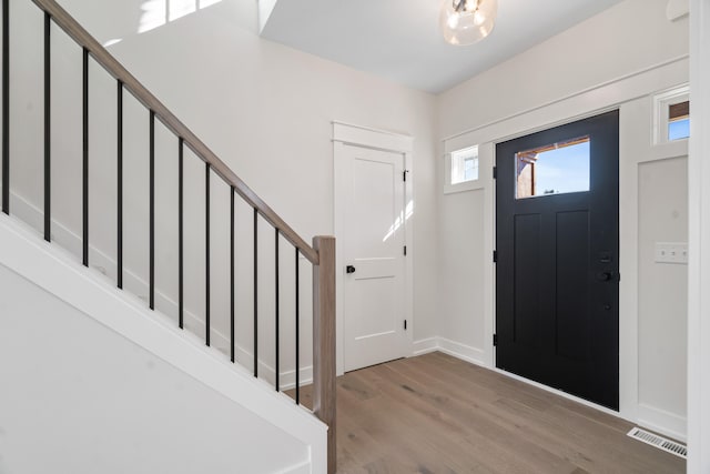 foyer with wood-type flooring