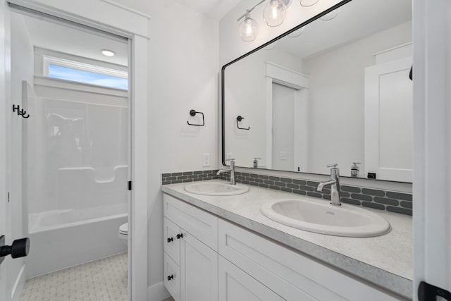 full bathroom featuring shower / tub combination, tasteful backsplash, vanity, and toilet