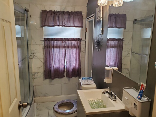 14153 Manning St, Detroit, MI 48205 - full bathroom featuring toilet, marble look tile flooring, a shower stall, vanity, and a chandelier