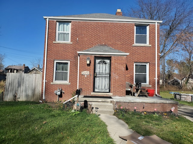 14153 Manning St, Detroit, MI 48205 - view of front of home featuring roof with shingles, a chimney, and brick siding