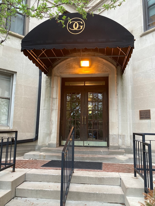 view of exterior entry featuring french doors