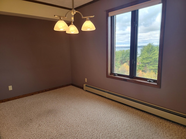 empty room with carpet flooring, a notable chandelier, and a baseboard heating unit