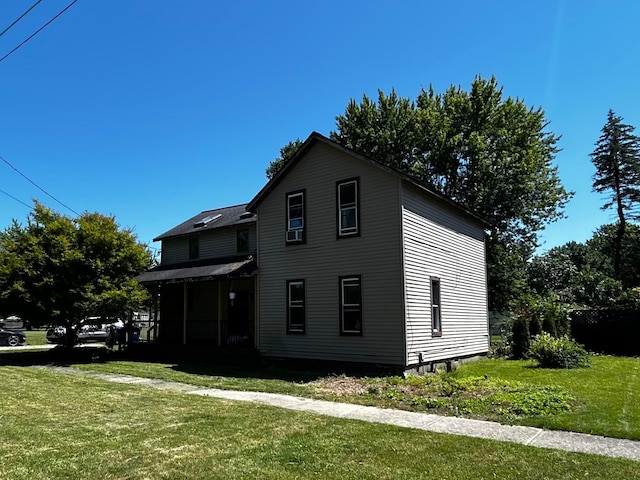 view of property exterior featuring a lawn