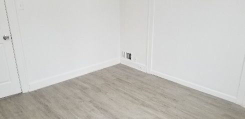 unfurnished room with light hardwood / wood-style flooring