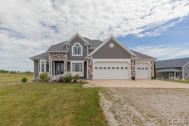 view of front facade featuring a front yard and a garage