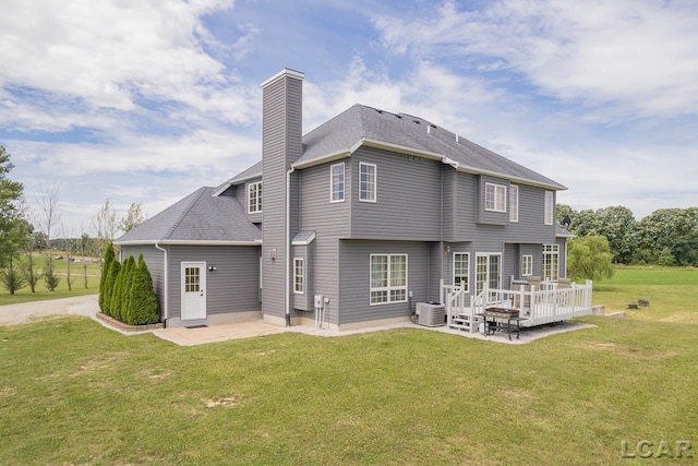 back of house with a patio area, a yard, a deck, and central AC