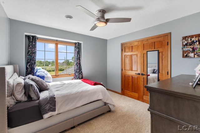 carpeted bedroom with ceiling fan